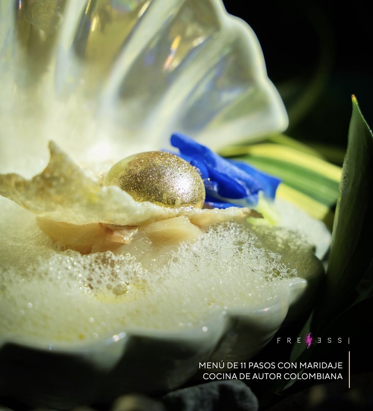 Golden sphere in seashell — haute cuisine artistry